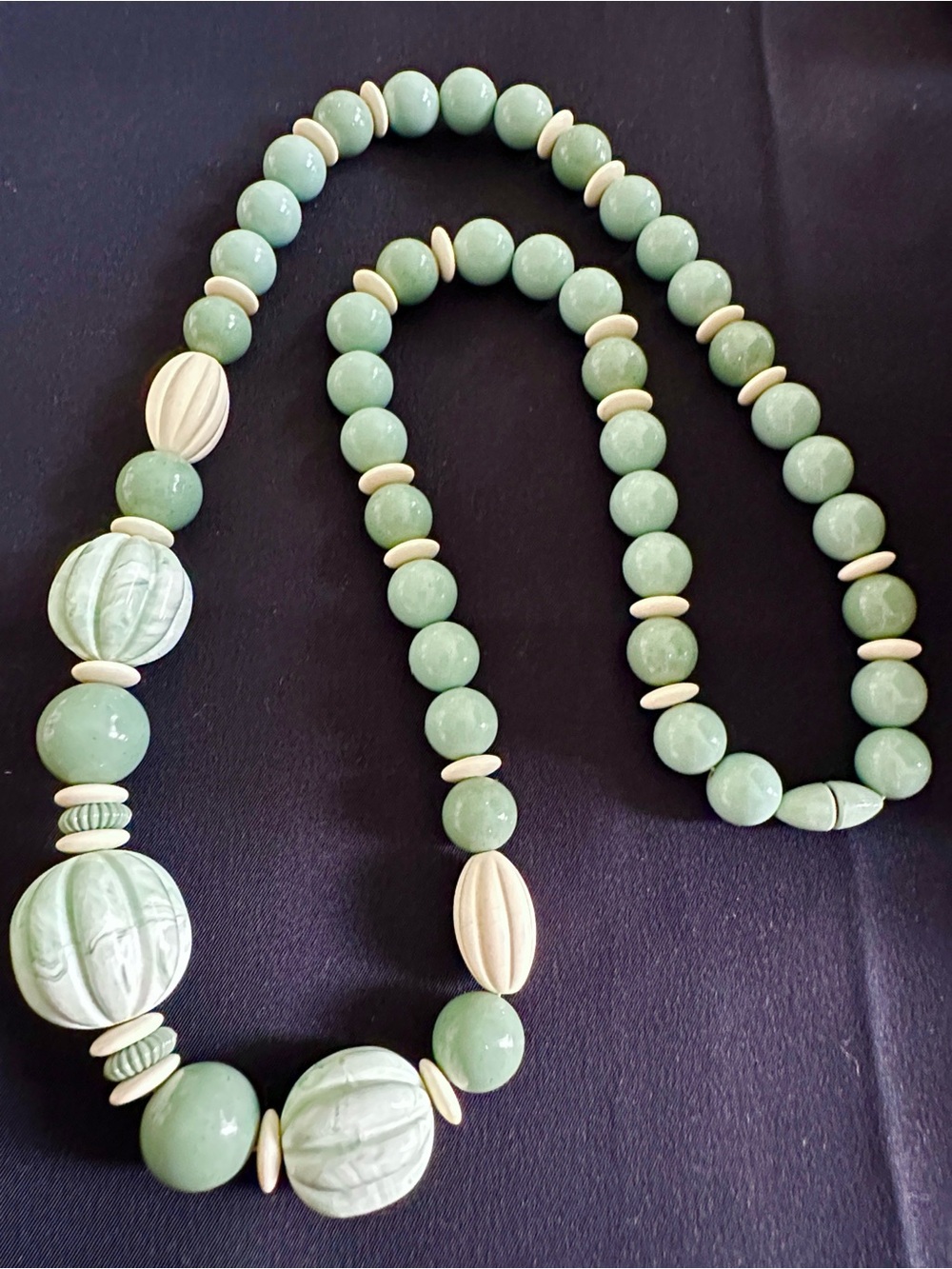 Vintage Avon EUC “Burst of Spring” green & cream lucite necklace. Appx. 27” drop